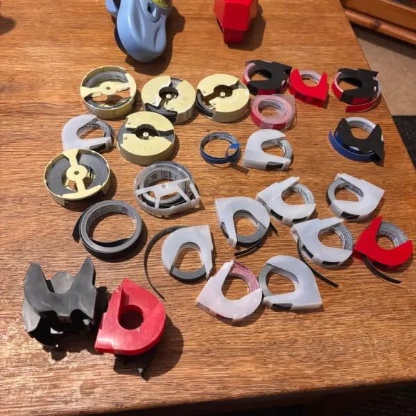 Two vintage DYMO machines and spare tape
