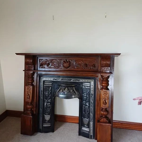 Mahogany surround with cast iron inset