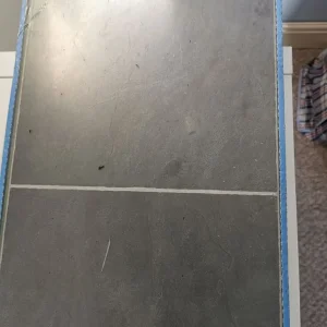 BNIB pack grey tile effect laminate flooring - Image 2