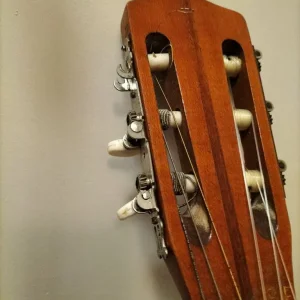 Classical guitar with broken peg