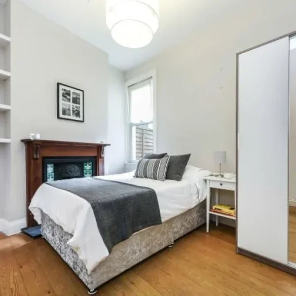 Double bedroom in a modern, tree-lined home 🌳