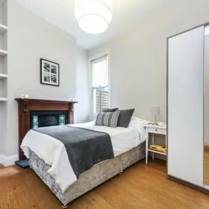 Double bedroom in a modern, tree-lined home 🌳