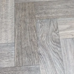Grey vinyl herringbone flooring 110x77"