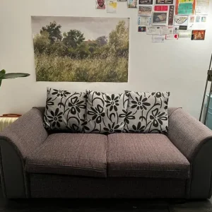 Large sofabed and grey cushions