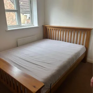 Solid oak double bed frame from Bensons for beds