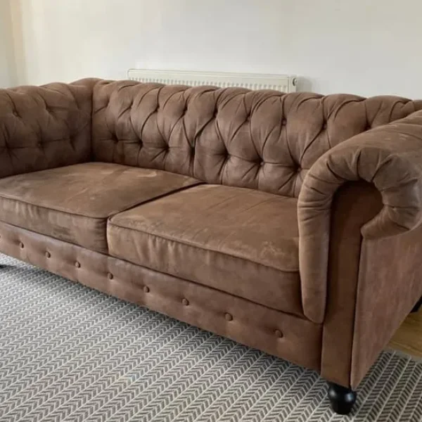 Brown Chesterfield-style couch