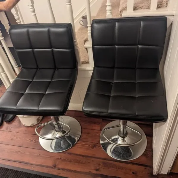 2x black leather and chrome bar stools