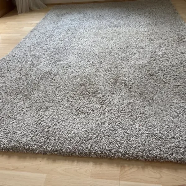 Large beige/cream medium pile rug