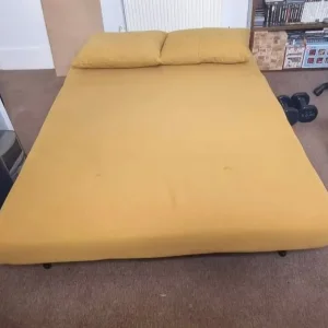 Made Haru small sofa bed in mustard yellow